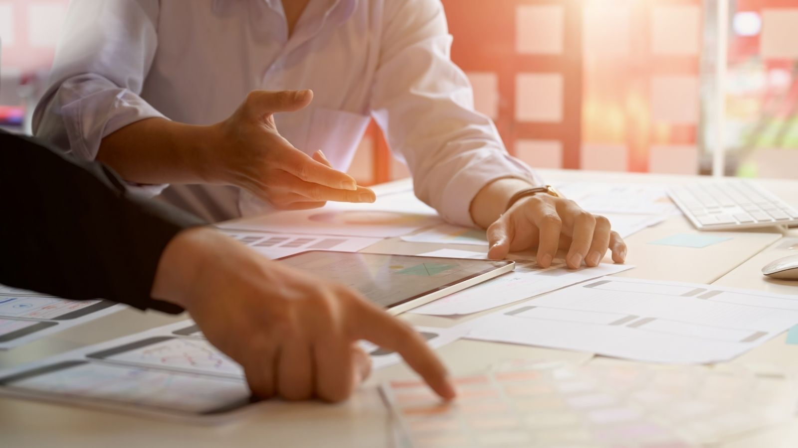 Plan a Media Campaign - Hands Planning with Papers